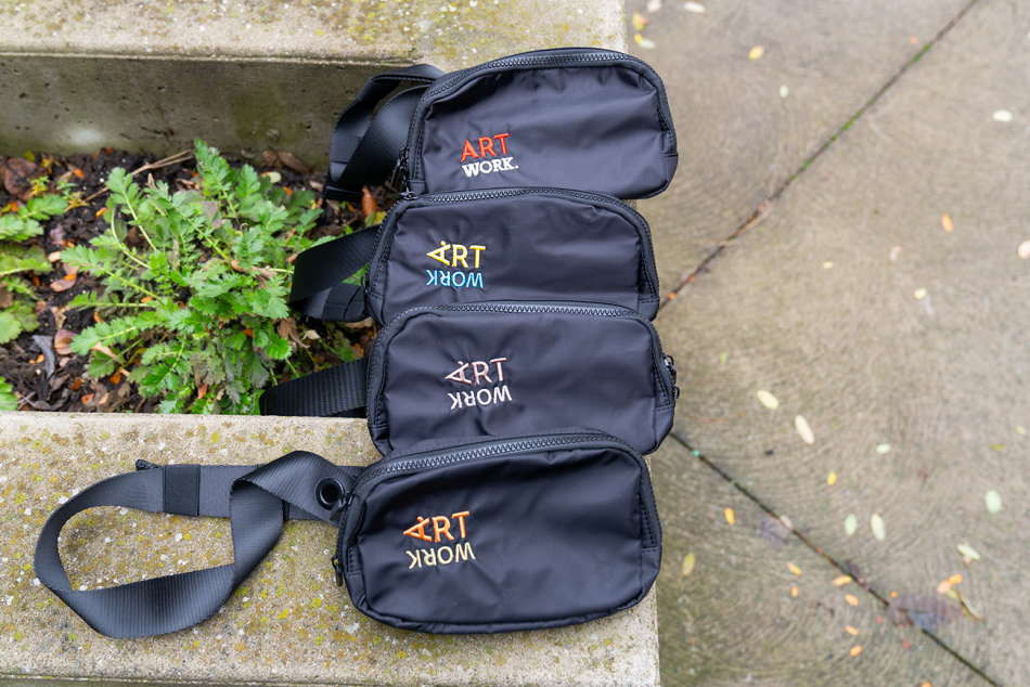 This is a photo of four of our fanny packs with a variety of text colours.